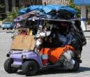 The way homeless people use a golf cart.jpg