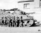 742px-Yanks_advance_into_a_Belgian_town.jpg
