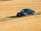 2007-Porsche-Cayman-Blue-Side-Angle-Speed-1280x960.jpg