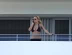 497304854_ritaorahangsoutbalconyx2_123_151lo.jpg